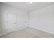 Bedroom features neutral carpet, recessed lighting, and two white doors at 4716 Crescent Square St # 1314, Raleigh, NC 27616