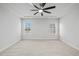 Large bedroom features tray ceiling, ceiling fan, neutral walls and carpet at 4716 Crescent Square St # 1314, Raleigh, NC 27616