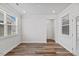 Bright bedroom with large windows showcasing laminate flooring and a welcoming atmosphere at 4716 Crescent Square St # 1314, Raleigh, NC 27616
