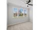Bright bedroom with large windows providing an abundance of natural light and neutral carpet at 4716 Crescent Square St # 1314, Raleigh, NC 27616