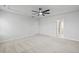 Spacious bedroom features ceiling fan, neutral walls and carpet, and white doors at 4716 Crescent Square St # 1314, Raleigh, NC 27616