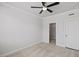 Neutral bedroom featuring a ceiling fan, carpet, and convenient access to the walk-in closet and bathroom at 4716 Crescent Square St # 1314, Raleigh, NC 27616