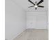 Bedroom featuring ceiling fan with neutral walls, neutral carpet, and white doors at 4716 Crescent Square St # 1314, Raleigh, NC 27616