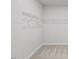 Bright closet with shelving racks and neutral-toned carpeting at 4716 Crescent Square St # 1314, Raleigh, NC 27616