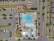 A high-angle perspective of a community pool, playground, and clubhouse, ideal for relaxation and recreation at 4716 Crescent Square St # 1314, Raleigh, NC 27616