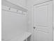 Welcoming entryway includes coat hooks, a built-in bench, and easy access to storage and other areas at 4716 Crescent Square St # 1314, Raleigh, NC 27616