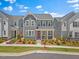 Charming two-story gray home with red door and neatly landscaped front yard at 4716 Crescent Square St # 1314, Raleigh, NC 27616