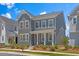 A gray two-story home featuring well-manicured landscaping with a mulch bed at 4716 Crescent Square St # 1314, Raleigh, NC 27616