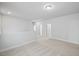 Bright hallway features neutral walls, carpet floors, and white doors leading to other rooms at 4716 Crescent Square St # 1314, Raleigh, NC 27616