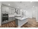 Modern kitchen showcasing a center island, stainless steel appliances, gray cabinets, and subway tile backsplash at 4716 Crescent Square St # 1314, Raleigh, NC 27616