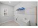 Laundry room featuring a stainless steel sink and a wire shelf at 4716 Crescent Square St # 1314, Raleigh, NC 27616
