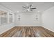 This living room features hardwood floors, a ceiling fan, and bright natural light at 4716 Crescent Square St # 1314, Raleigh, NC 27616