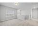 Sunlit loft area features neutral walls, carpet, and offers views of the neighborhood at 4716 Crescent Square St # 1314, Raleigh, NC 27616