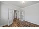 Home office with double French doors and hardwood flooring at 4716 Crescent Square St # 1314, Raleigh, NC 27616