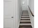 Clean staircase leads to the next level of this home, enhancing accessibility and style at 4716 Crescent Square St # 1314, Raleigh, NC 27616