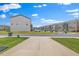 View of community featuring two-story homes with attached garages and green landscaping at 4716 Crescent Square St # 1314, Raleigh, NC 27616