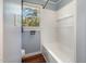 This bathroom boasts a combination bathtub and shower with a window for natural light at 500 Ellen Dr, Knightdale, NC 27545