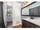 Bathroom with vanity, mirror, and view into the toilet and shower area at 500 Ellen Dr, Knightdale, NC 27545