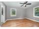 Bedroom with hardwood floors, neutral paint, and two windows providing natural light at 500 Ellen Dr, Knightdale, NC 27545