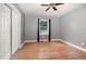 Cozy bedroom with hardwood floors, closet and a view of the yard through the window at 500 Ellen Dr, Knightdale, NC 27545