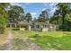 View of charming one-story home and detached garage with well-maintained lawn and driveway at 500 Ellen Dr, Knightdale, NC 27545
