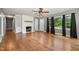 Spacious living room with hardwood floors, fireplace, and natural light from large windows at 500 Ellen Dr, Knightdale, NC 27545