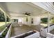 This covered patio features a brick fireplace and ceiling fan for comfortable outdoor living at 500 Ellen Dr, Knightdale, NC 27545