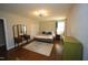 Bedroom features hardwood floors, neutral colors, and generous natural light at 5112 Stephens Ln, Durham, NC 27712