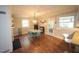 Charming dining area featuring hardwood floors, a vintage table set, and plenty of natural light at 5112 Stephens Ln, Durham, NC 27712