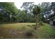 Expansive front yard with mature trees and a well-maintained lawn at 5112 Stephens Ln, Durham, NC 27712