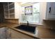 Close up of the kitchen sink and stained glass window at 5112 Stephens Ln, Durham, NC 27712