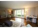 Open living space with hardwood floors, bright windows, and comfortable seating at 5112 Stephens Ln, Durham, NC 27712
