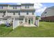 This backyard features a green lawn, patio, and a privacy fence at 523 Berry Chase Way, Cary, NC 27519