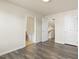 This airy bedroom features hardwood floors, neutral colors, and easy bathroom access at 523 Berry Chase Way, Cary, NC 27519