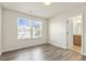 Bedroom with hardwood floors and access to the bathroom at 523 Berry Chase Way, Cary, NC 27519