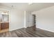 This bedroom features hardwood floors, neutral colors, and nearby laundry and bath at 523 Berry Chase Way, Cary, NC 27519