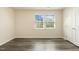 Bedroom with hardwood floors and a double window at 523 Berry Chase Way, Cary, NC 27519