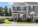 Charming townhome featuring a brick exterior and a well-maintained front yard at 523 Berry Chase Way, Cary, NC 27519