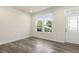 Well-lit living room with hardwood floors and a front door at 523 Berry Chase Way, Cary, NC 27519