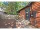 Backyard with a fenced area, wood fence, stone-lined walkway, and access door at 5315 Mccormick Rd, Durham, NC 27713