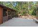 A backyard deck and firepit amongst the trees at 5315 Mccormick Rd, Durham, NC 27713