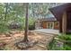 Secluded backyard features fire pit, back deck, and bench seating at 5315 Mccormick Rd, Durham, NC 27713