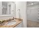 Bathroom featuring granite countertop vanity and a closet at 5315 Mccormick Rd, Durham, NC 27713