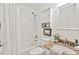 Bathroom with granite vanity, tiled shower, and updated fixtures at 5315 Mccormick Rd, Durham, NC 27713