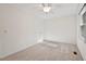 Cozy bedroom with plush carpeting and a ceiling fan for added comfort at 5315 Mccormick Rd, Durham, NC 27713