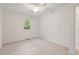 Comfortable bedroom features soft carpeting and a ceiling fan fixture at 5315 Mccormick Rd, Durham, NC 27713