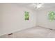 Inviting bedroom with natural light, neutral carpet, and ample space at 5315 Mccormick Rd, Durham, NC 27713