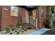 Charming home entrance featuring manicured landscaping and decorative lighting at 5315 Mccormick Rd, Durham, NC 27713