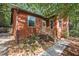 View of the front exterior with a brick foundation, attractive landscaping, and a walkway at 5315 Mccormick Rd, Durham, NC 27713