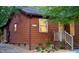 Exterior view of home with address, tidy yard, mature trees, and lush landscaping at 5315 Mccormick Rd, Durham, NC 27713